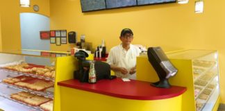 Sad Dad’s Photo Goes Viral and Boosts Business of New Donut Shop