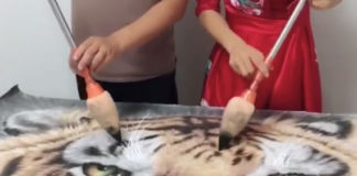 Watch Two Artists Paint Simultaneously to Create Hyperrealistic Art