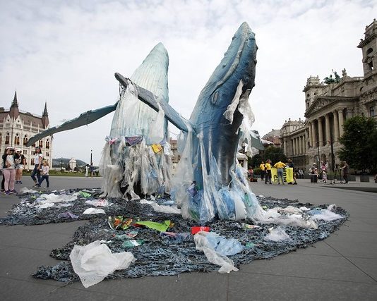 Greenpeace Activist Makes a Sculpture of Whales to Warn About Water Polluting