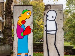 Two Street Artists Paint on Parts of the Berlin Wall for 30th Anniversary of its Fall