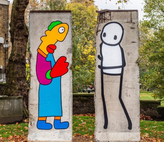 Two Street Artists Paint on Parts of the Berlin Wall for 30th Anniversary of its Fall